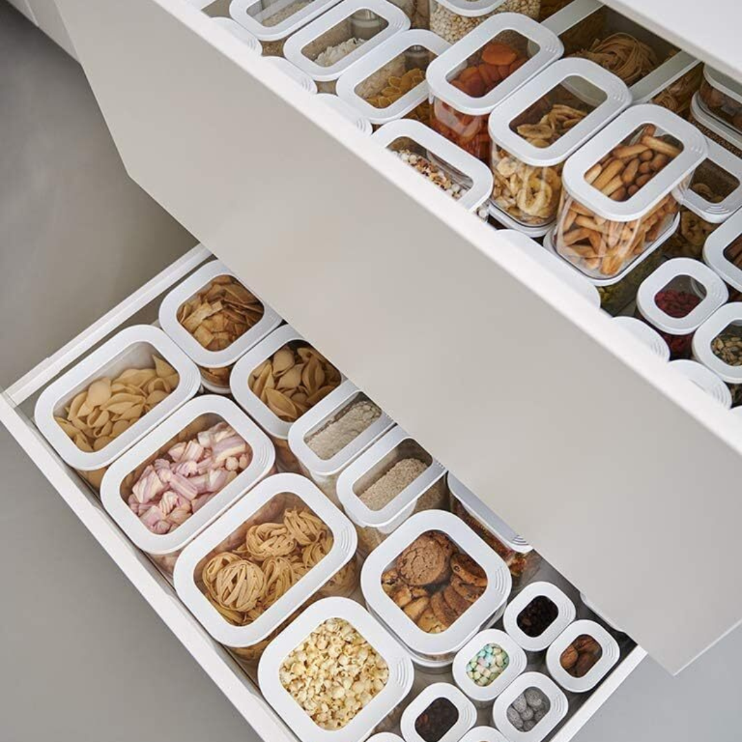 Storage jars arranged on an organized kitchen counter