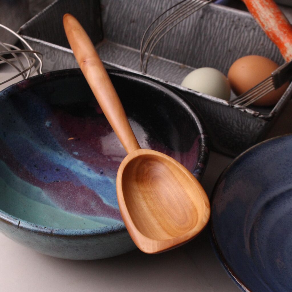 Handmade treenware wooden stirring spoon carved from salvaged Apple wood with a spatula end.